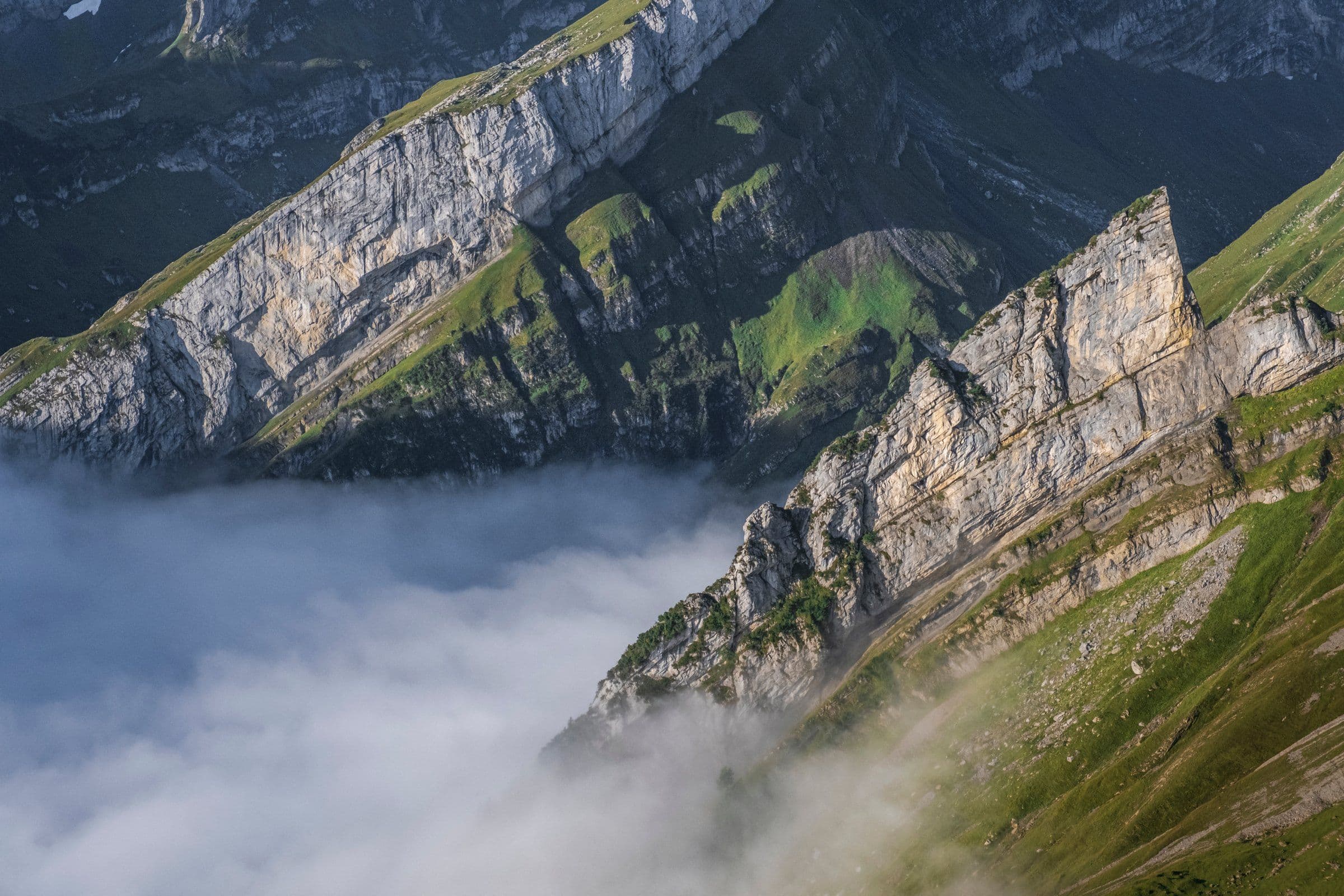 Limestone ridges rising out of a sea of fog
