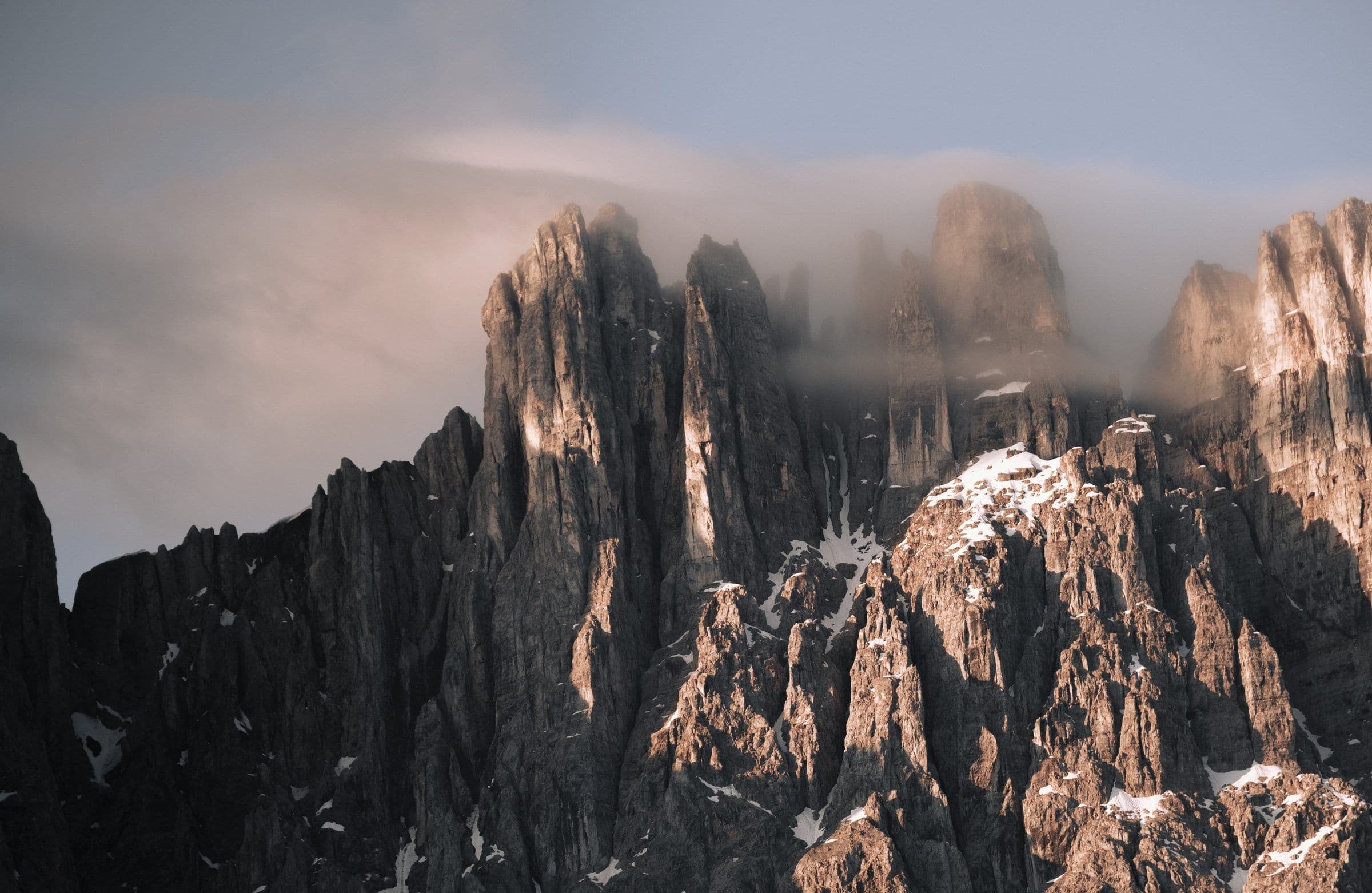 Dolomite spires half-hidden in passing cloud